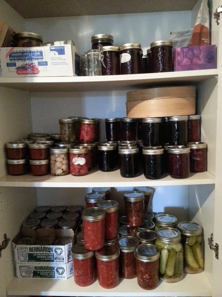 Shelves of jarred sauces, chutneys and pickles
